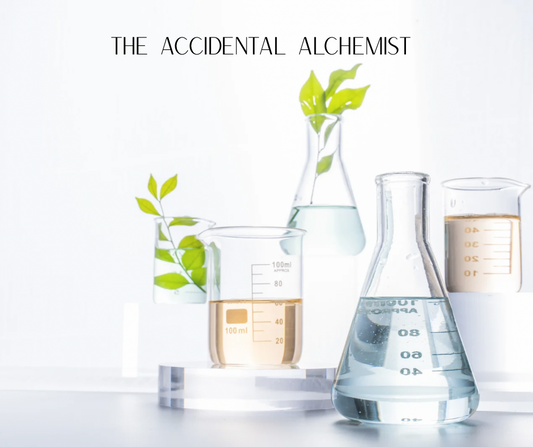 A picture of beakers with botanicals and oils