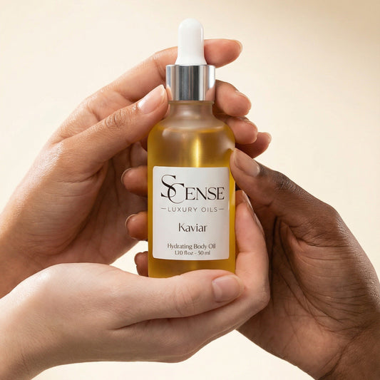 Bottle of skincare serum held by two hands against a beige background